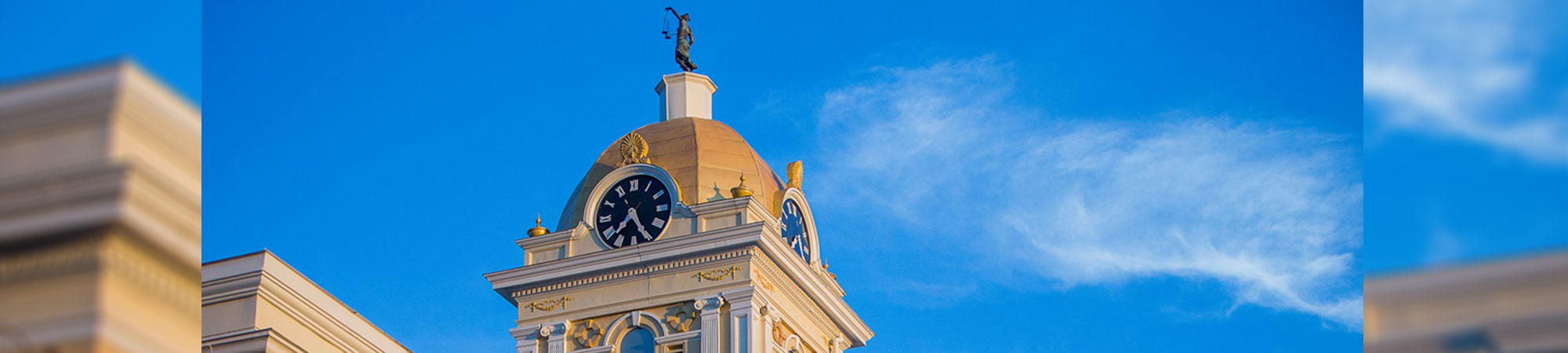 cupola with clock on top of courthouse